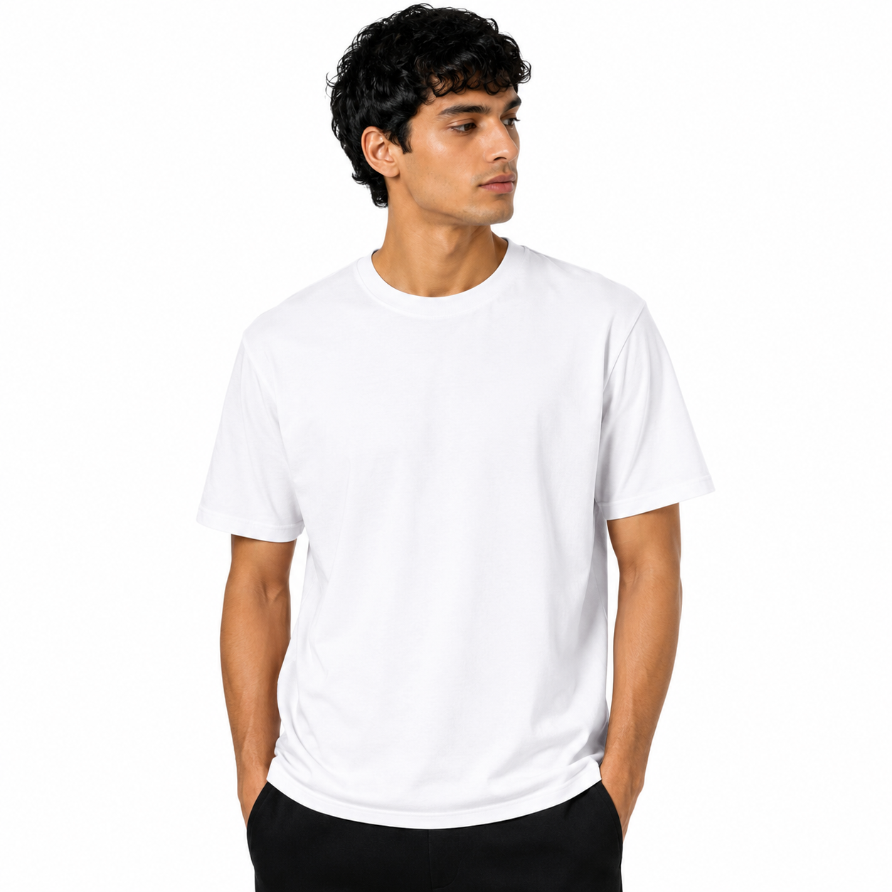 A man wearing a plain white short-sleeve crewneck t-shirt and black pants, standing against a solid white background.