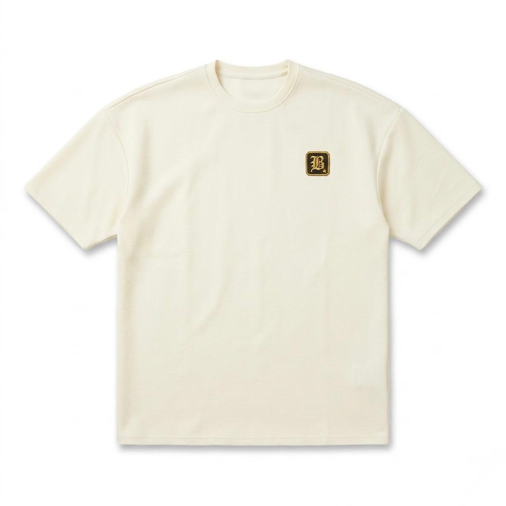 Beige t-shirt with a small logo on a white background