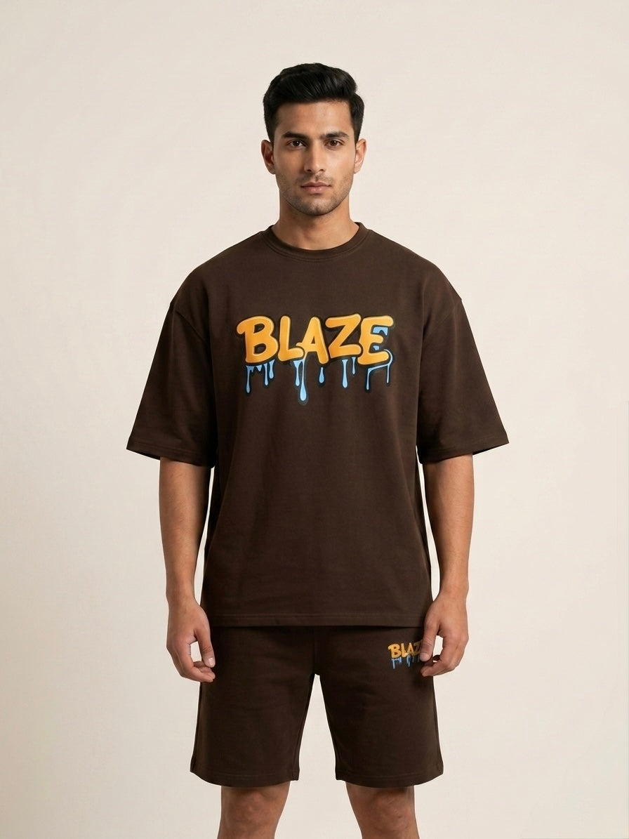 Man wearing a brown 'Blaze' t-shirt and shorts on a beige background