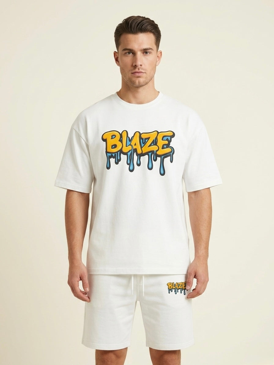 Man wearing a white t-shirt with 'BLAZE' logo and matching shorts on a beige background